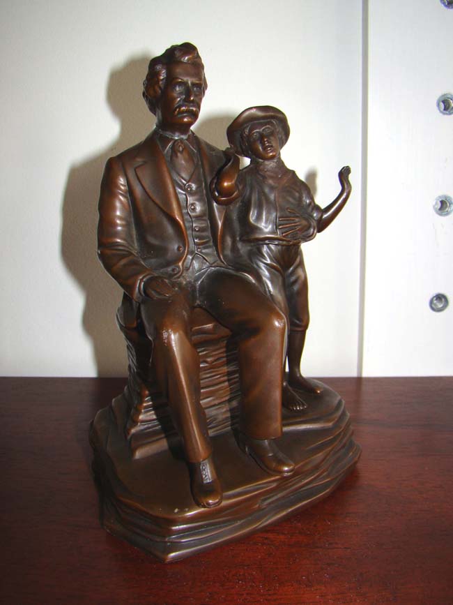 A fine and rare single bookend featuring Mark Twain and Tom Sawyer made by Jennings Brothers of Bridgeport, CT., circa 1930